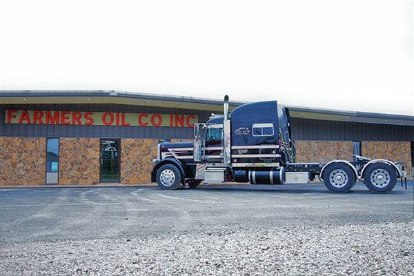 Farmers Oil Co. Inc. building in Anthony, Kansas, with a truck parked out front