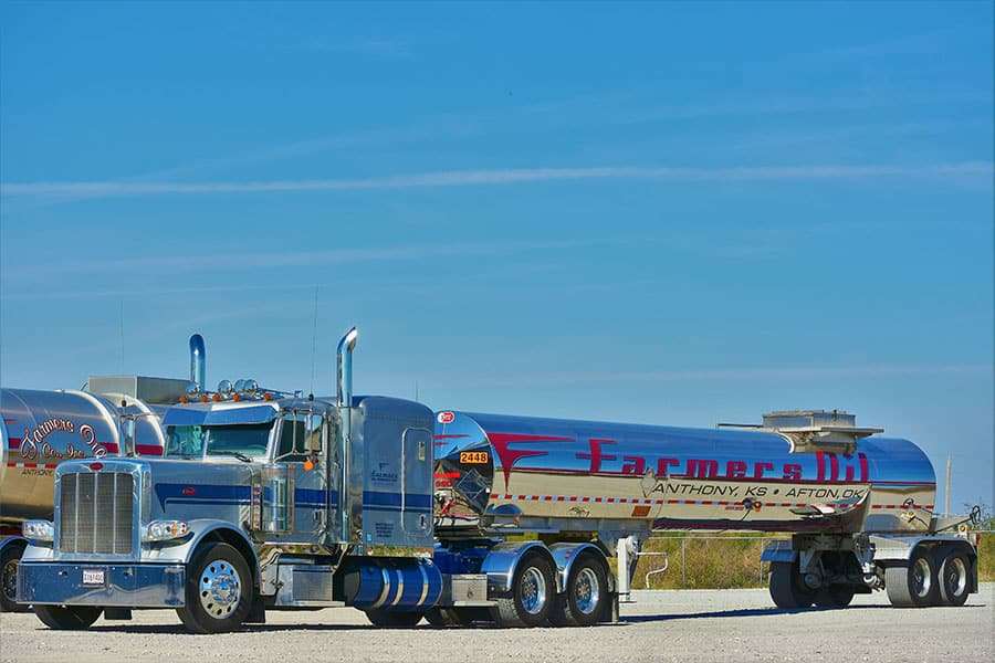Blue Farmers Oil Peterbilt with a mirror-chrome tanker