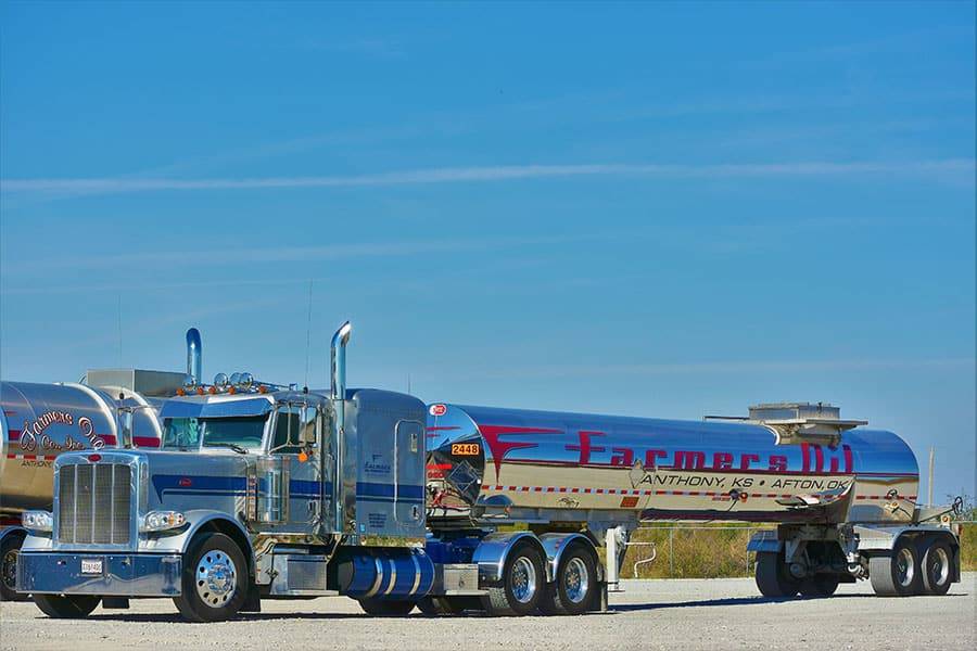 Blue Farmers Oil Peterbilt with a mirror-chrome tanker